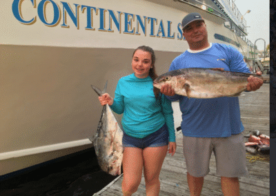 father and daughter two fish